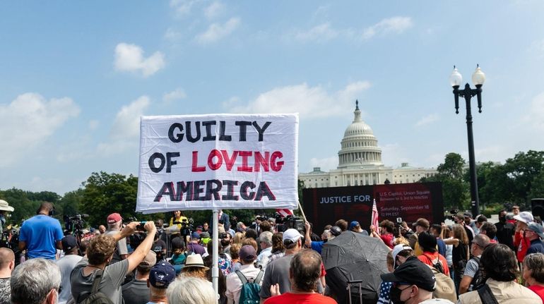 Demonstrators gather during a "Justice for J6" rally near the...