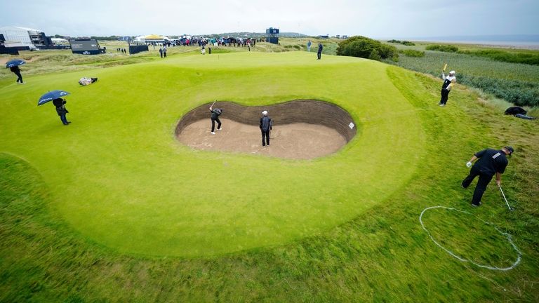 Denmark's Rasmus Hojgaard plays out of a bunker on the...