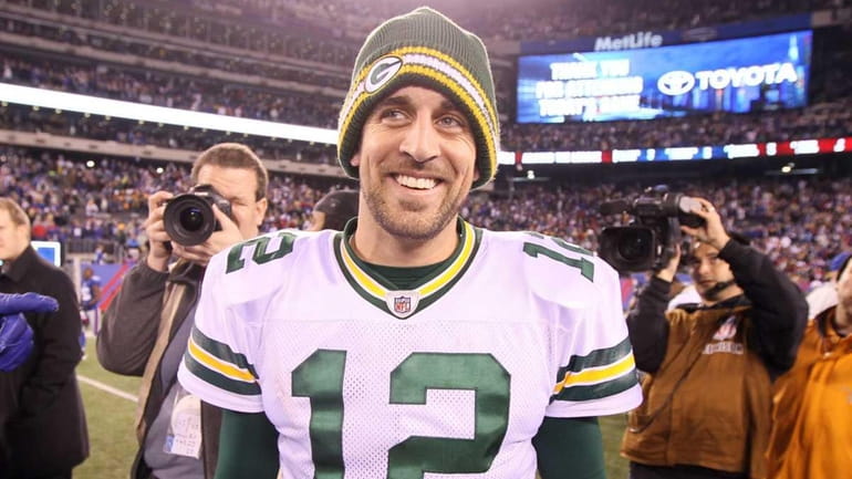 Aaron Rodgers of the Green Bay Packers smiles after defeating...