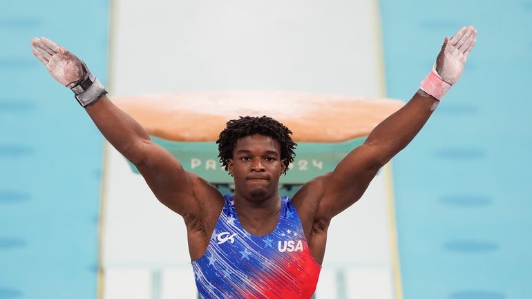 Frederick Richard, of the United States, performs on the vault...