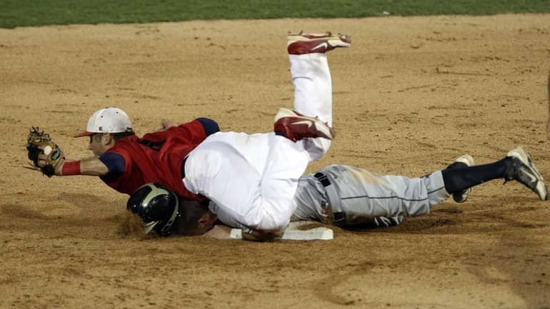 Central Florida's Travis Shreve, bottom, is out at second as...