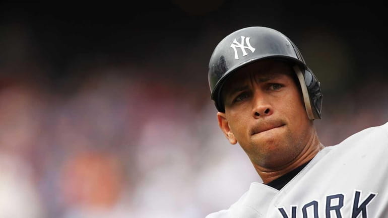Alex Rodriguez of the New York Yankees looks on before...