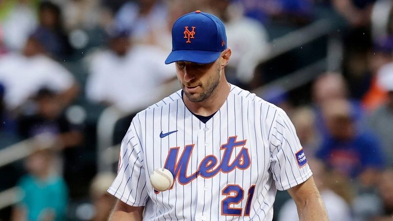 Max Scherzer of the Mets stands on the mound during the...