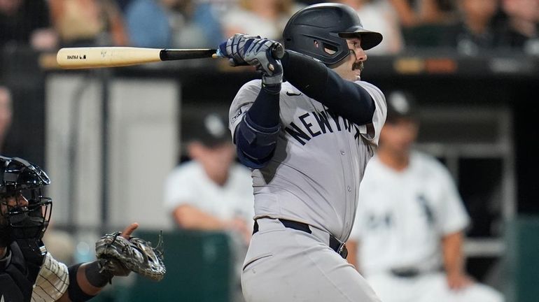 Yankees' Austin Wells hits a single during the seventh inning...