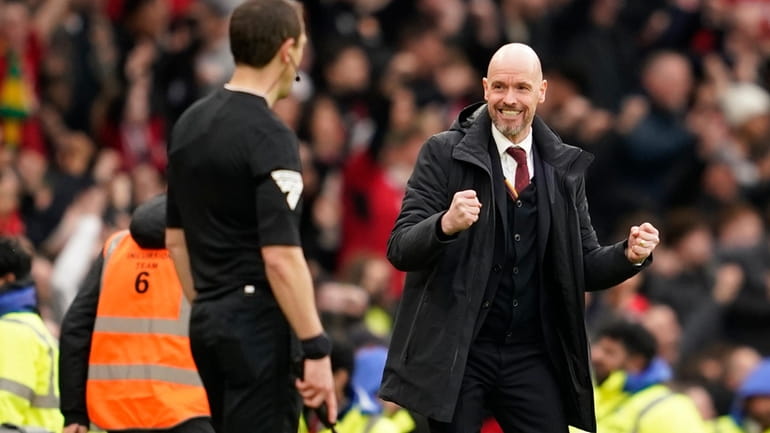 Manchester United's head coach Erik ten Hag celebrates after Manchester...