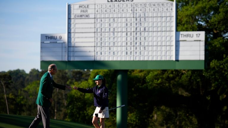 Ava Estrella, 14, of Brookville, reacts after putting at the...