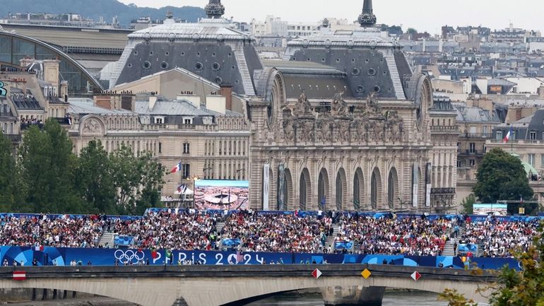 Visitors are seen on a bridge ahead of the opening...