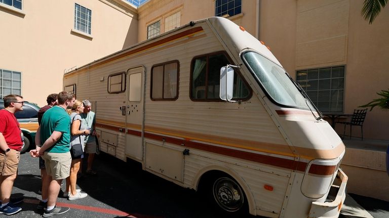 Tourists view the RV used in Breaking Bad as they...