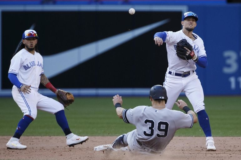 Getty Images - Vladimir Guerrero Jr. #27 and Bo Bichette #11 of