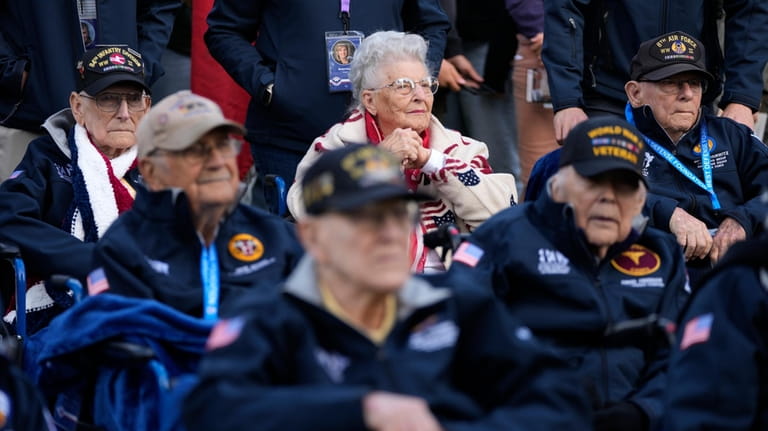 U.S. World War II veteran Anna Mae Krier, center rear,...