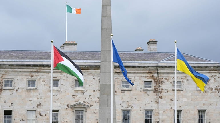 The Palestinian flag flies outside Leinster House, Dublin, following the...
