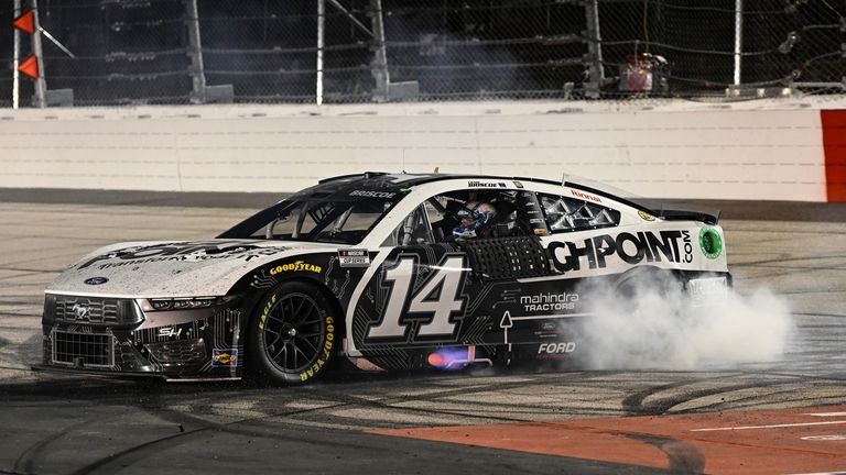 Chase Briscoe does a burnout after winning a NASCAR Cup...