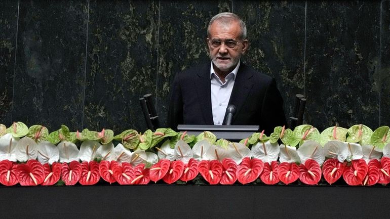 Newly-elected President Masoud Pezeshkian delivers a speech after taking his...