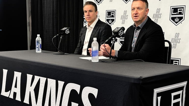 Los Angeles Kings head coach Jim Hiller, left, and general...