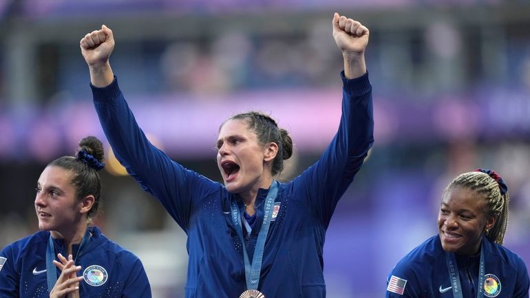 United States' Ilona Maher, centre reacts as she stands on...