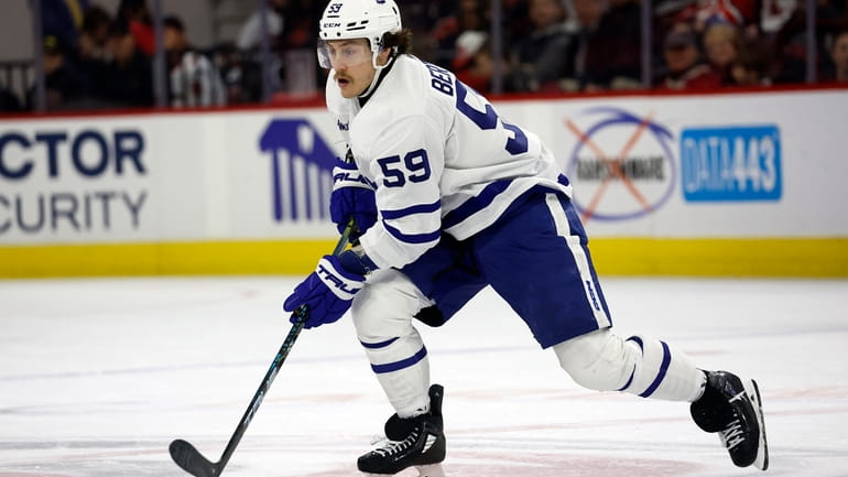 Toronto Maple Leafs' Tyler Bertuzzi (59) skates with the puck...