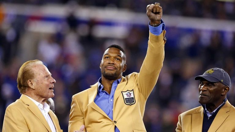 Michael Strahan is presented with his Pro Football Hall of...