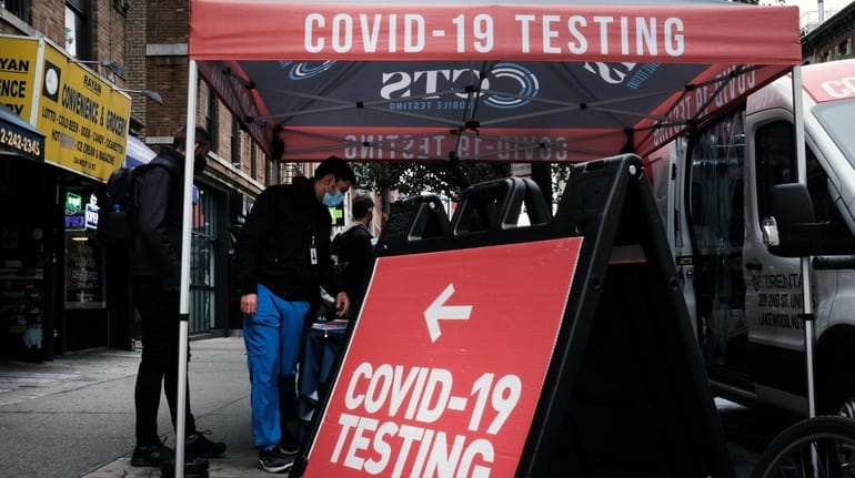 A COVID-19 pop-up testing site stands on a Manhattan street on Oct. 26.
