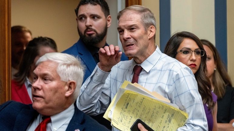 House Judiciary Committee Chair Jim Jordan, R-Ohio, center, flanked by...