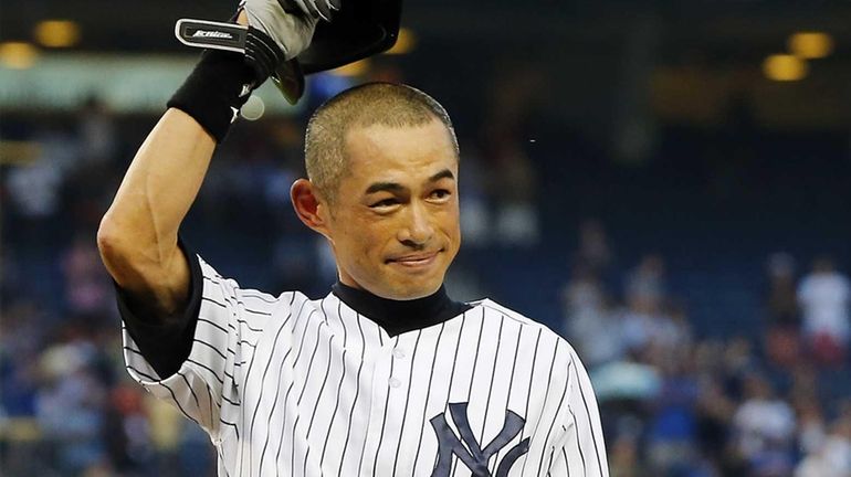 Ichiro Suzuki of the Yankees salutes the crowd after his...