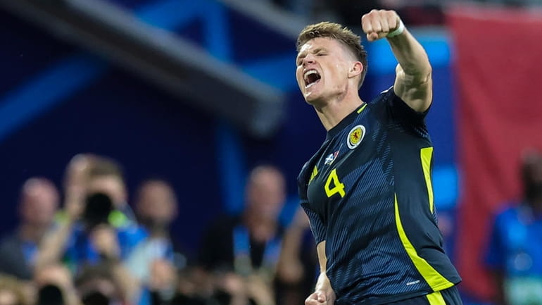 Scotland's Scott McTominay celebrates after Switzerland's Fabian Schar scored an...