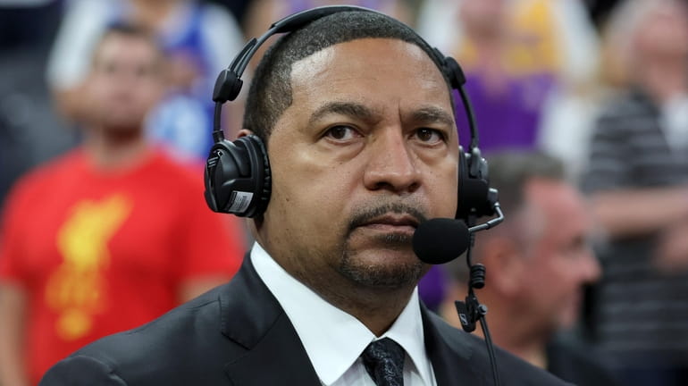 ESPN NBA analyst Mark Jackson stands for the American national...