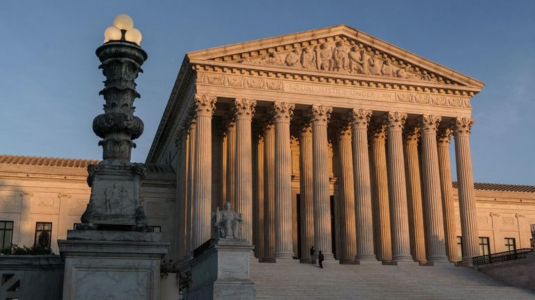 The Supreme Court is seen at sundown in Washington, on...