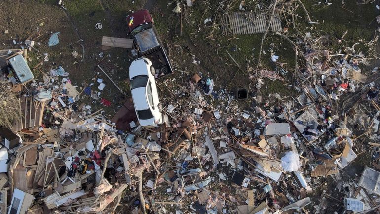 Damage is visible Sunday in Rolling Fork, Miss., after a tornado...