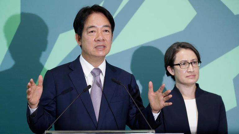 Taiwan Vice President William Lai, left, the candidate for presidential...