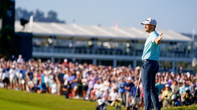 Wyndham Clark celebrates after a birdie on the 14th hole...