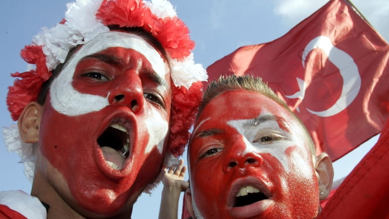FILE -Turkey's fans celebrate at the KoelnArena-Dome prior to the...