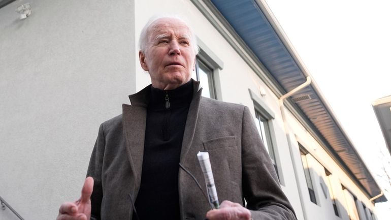 President Joe Biden speaks with reporters as he leaves St....