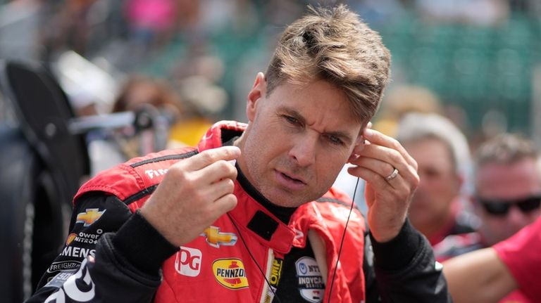 Will Power, of Australia, prepares to drive during qualifications for...