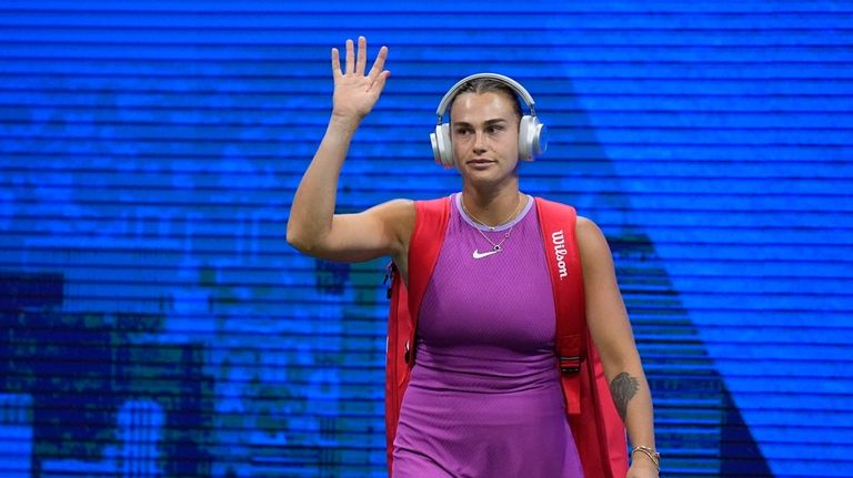 Aryna Sabalenka, of Belarus, walks onto the court before the...