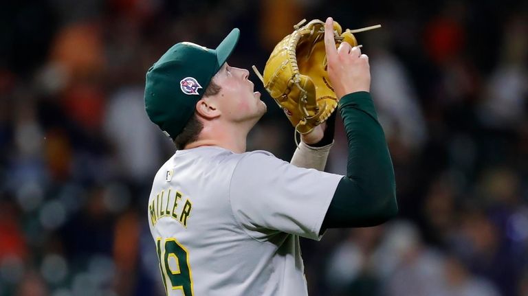 Oakland Athletics closing pitcher Mason Miller reacts after Houston Astros'...