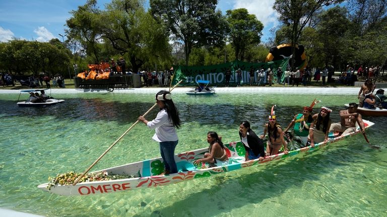 Waorani Indigenous women take part in a demonstration in Quito,...