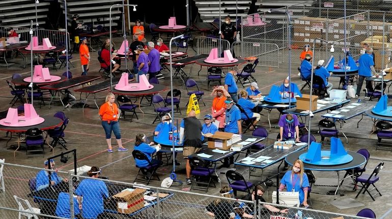 Maricopa County ballots from the 2020 general election being recounted...