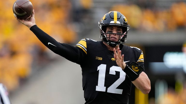 Iowa quarterback Cade McNamara throws a pass during the second...