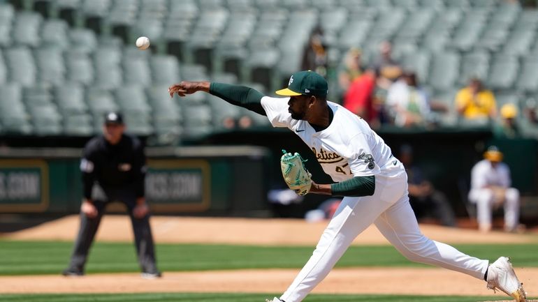 Oakland Athletics pitcher Michel Otañez throws to a Tampa Bay...