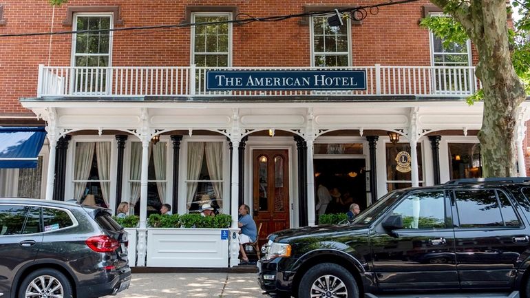 FILE — Patrons sit outside at The American Hotel, June...