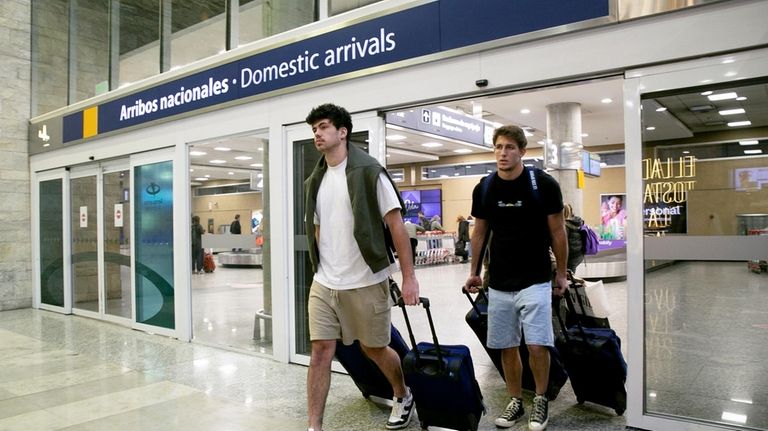 French rugby players Oscar Jegou, right, and Hugo Auradou arrive...