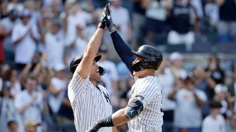 Aaron Judge of the Yankees celebrates his seventh inning home run...