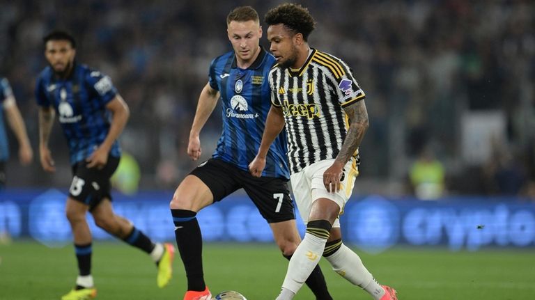 Juventus' Weston McKennie, front, plays the ball during the Italian...