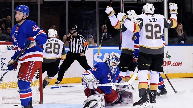 Rangers goaltender Henrik Lundqvist and defenseman Neal Pionk react as...