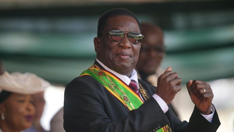 Zimbabwe President Emmerson Mnangagwa gestures during his inauguration ceremony at...