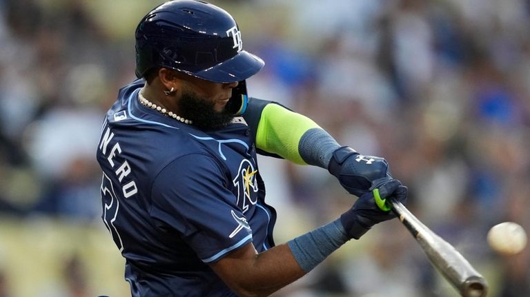 Tampa Bay Rays' Junior Caminero hits a home run during...