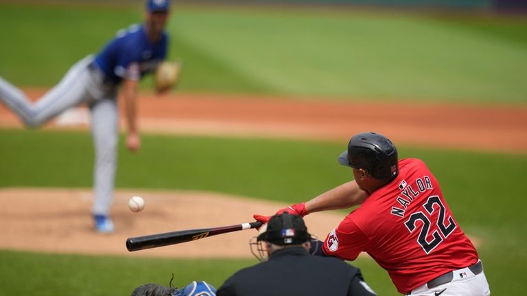 Cleveland Guardians' Josh Naylor (22) hits a fielder's choice, scoring...