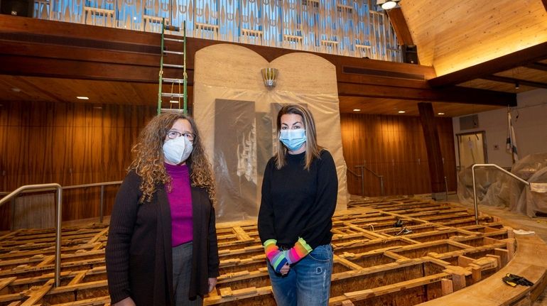 Rabbi Randy Sheinberg, left, and Andrea Comerchero, president of Temple Tikvah, stand...