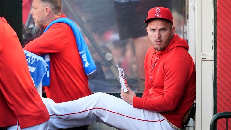 Los Angeles Angels center fielder Mike Trout sits in the...