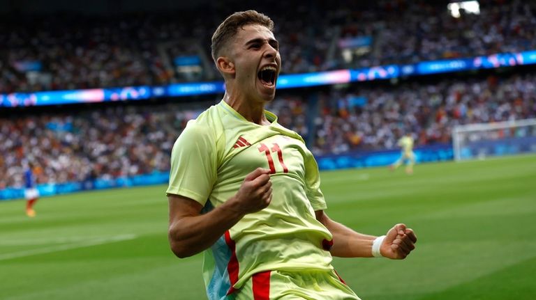 Spain's Lopez Fermin celebrates after scoring his goal during the...